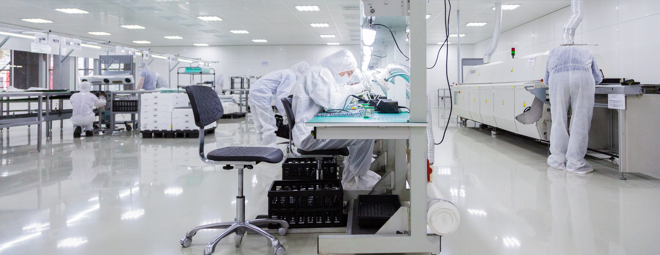 Workers assembling electronics on a manufacturing line in Vietnam