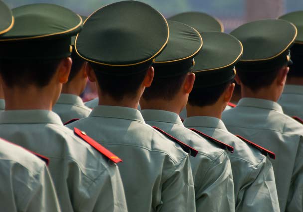 Rows of uniformed personnel reflecting China's geopolitical and labor risk landscape
