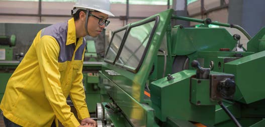 Worker operating machinery at an East China factory