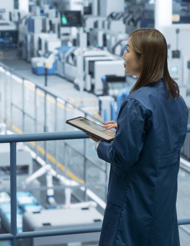 Engineer monitoring production on an East China manufacturing floor